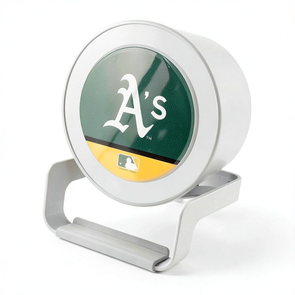 Keyscaper Athletics Night Light Charger on a nightstand with phone charging